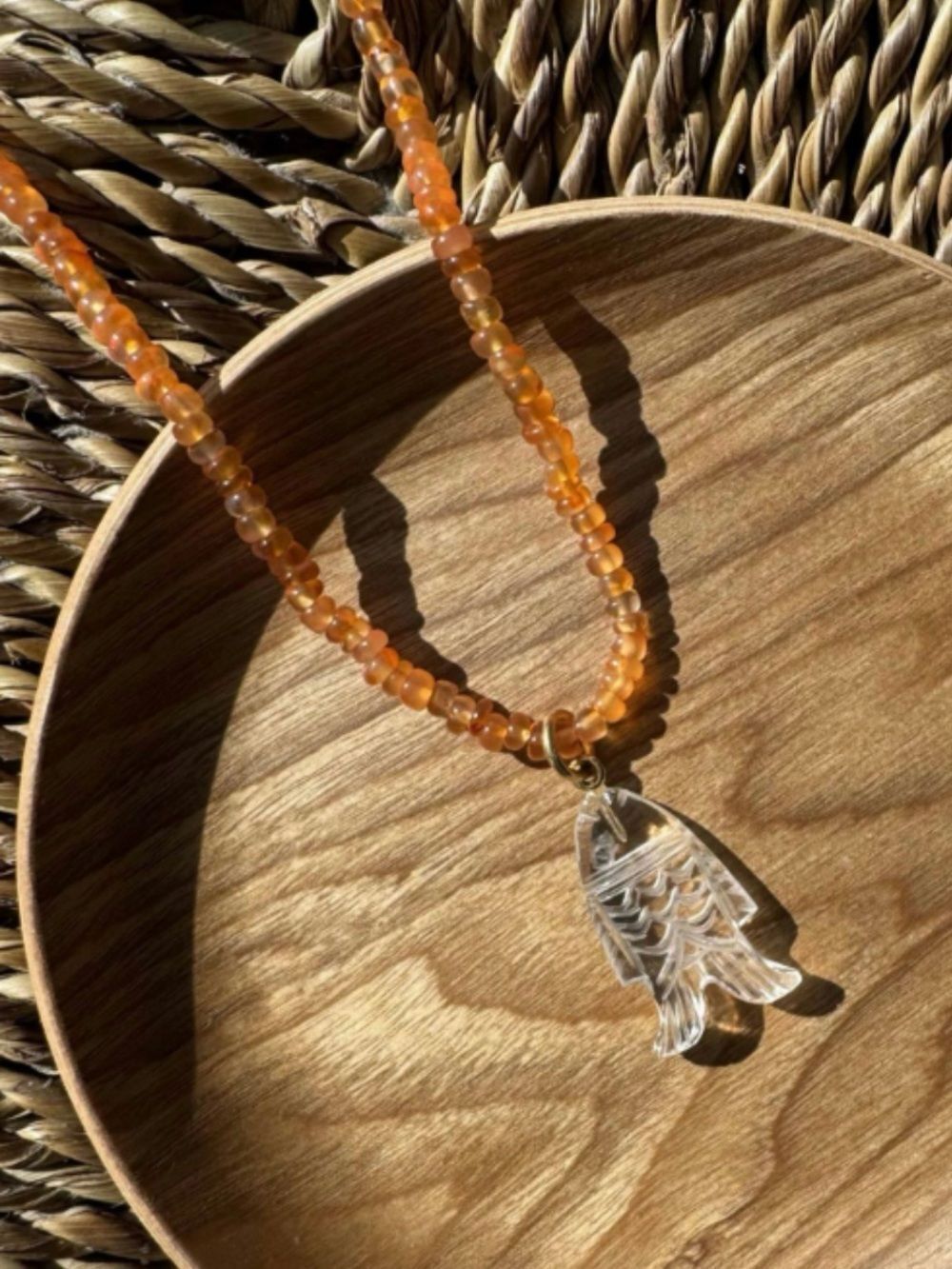 Mayamar Orange Glass Bead Necklace with Clear Fish Charm